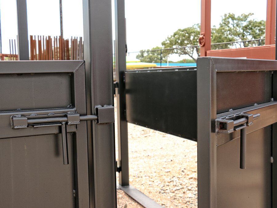 Closer view of the heavy-duty slide latches on the mare-colt horse stock
